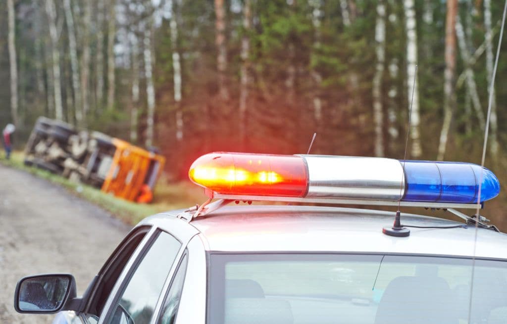 a police car parked on the side of a road