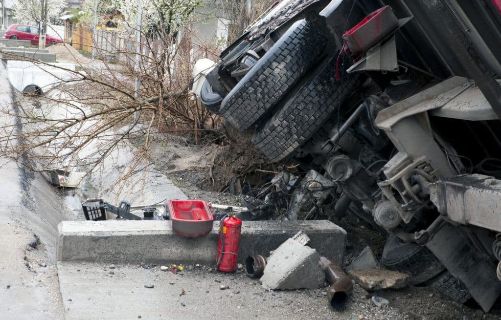 a pile of rubble next to a red fire hydrant