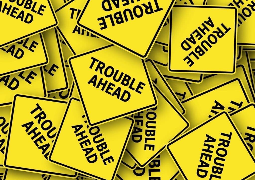 a pile of yellow road signs