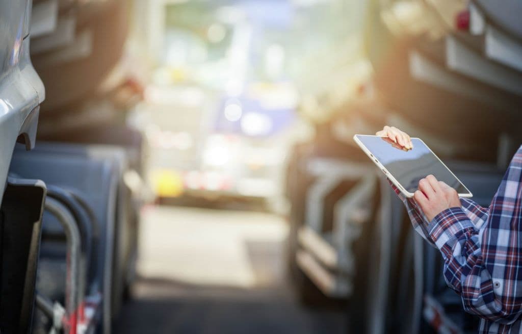 a woman is holding a tablet in her hands